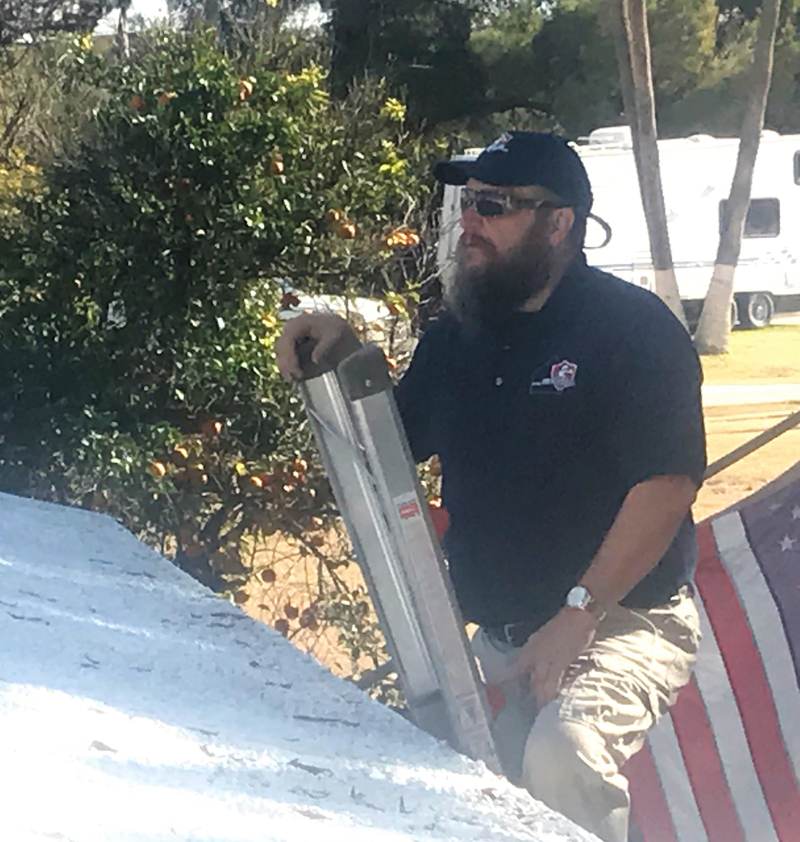 Mike-on-the-ladder-inspecting